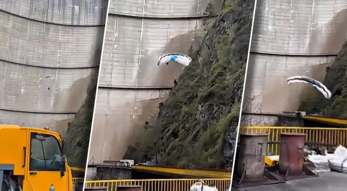 Moment neașteptat la Barajul Vidraru: un parapantist a surprins muncitorii din zonă