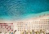 O regiune mai puțin cunoscută din Grecia este alternativa accesibilă la Santorini. Resorturi de lux și plaje cu nisip auriu